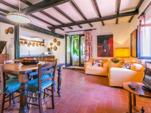 a kitchen and living room with a table and chairs at Holiday Home Bardeggiano - Caterina 5 by Interhome in Belvedere +39 photos