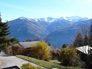 a house with a view of a mountain at Apartment Centaure B RS 2 by Interhome in Ovronnaz
