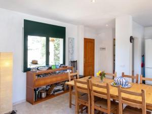 a kitchen and dining room with a table and chairs at Holiday Home Mas Pere by Interhome in Calonge