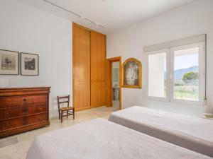 Łóżko lub łóżka w pokoju w obiekcie Holiday Home La Veleta by Interhome