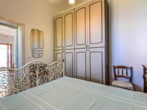 Giường trong phòng chung tại Holiday Home Baroccia da Mary by Interhome