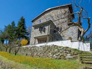 a stone house on top of a stone wall at Holiday Home Girasole - PZI130 by Interhome in Piazza al Serchio