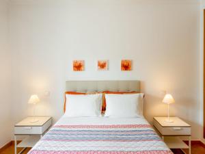 a bedroom with a large bed with two night stands at Villa Villa Pescada by Interhome in Albufeira