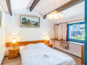 Holiday Home Hameau du golf-6 by Interhome 객실 침대