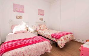 Giường trong phòng chung tại Villa Torre Paraíso
