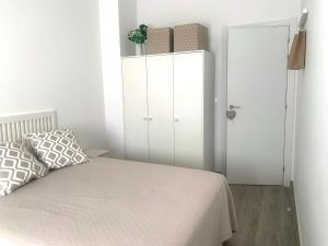 Łóżko lub łóżka w pokoju w obiekcie Apartamento en el Centro con Parking