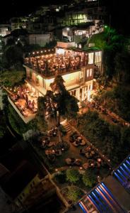 an overhead view of a building with a courtyard at night at 193 Urban Hotel in Patra