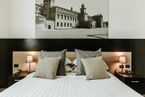 Ένα ή περισσότερα κρεβάτια σε δωμάτιο στο Hotel Carpi
