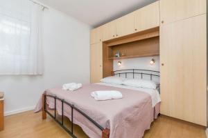 Postel nebo postele na pokoji v ubytování Apartments Josip