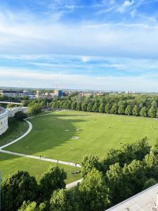 an aerial view of a large green field with trees at Panorama Home mit Weitblick auf die City in Ingolstadt