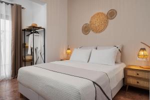 Posteľ alebo postele v izbe v ubytovaní Nexus Downtown Apartment