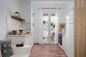 Kuchyňa alebo kuchynka v ubytovaní Nexus Downtown Apartment