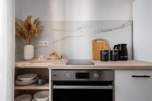 Kuchyňa alebo kuchynka v ubytovaní Nexus Downtown Apartment
