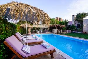 Fotografie z fotogalerie ubytování Villa Irene: Θέα πισίνα, Θέα θάλασσα v destinaci Áyioi