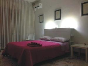 Postel nebo postele na pokoji v ubytování Rosa dei Venti B&B