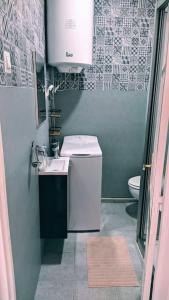 a small bathroom with a sink and a toilet at Ático encantador... in A Coruña