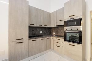 A kitchen or kitchenette at Scudaniglio Home Még 16 kép