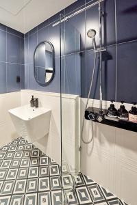 a bathroom with a sink and a mirror at SN Hotel Daecheon in Boryeong