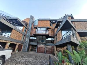 an exterior view of a brick building at Manor on the Hill in Krugersdorp