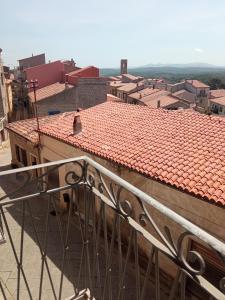 a view of a building with red tile roofs at Violivia in Aggius