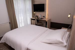 Postel nebo postele na pokoji v ubytování Hotel Kastanienhof
