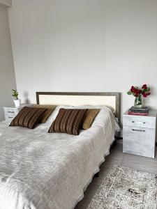 Postel nebo postele na pokoji v ubytování Meiman House close to Asia Mall