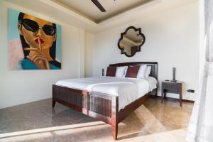 Un pat sau paturi într-o cameră la Villa Manolo