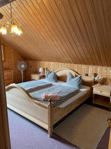 a bedroom with a large bed in a room at Westerwälder Hof Windhagen in Windhagen