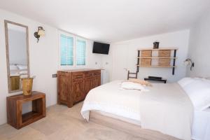 Кровать или кровати в номере La Finquita - Adeje