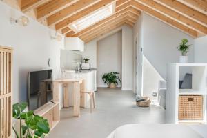 Televízia a/alebo spoločenská miestnosť v ubytovaní BAO5 APARTAMENTO