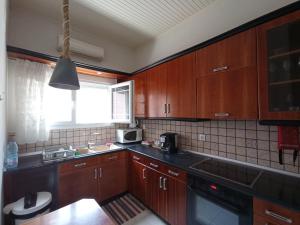 A kitchen or kitchenette at Sweet Maisonette in Corfu Town