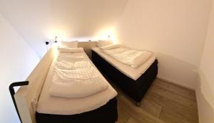 Postel nebo postele na pokoji v ubytování GEG Hotel