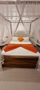 a bed in a tent in a room at Maduranga n Guest in Mirissa