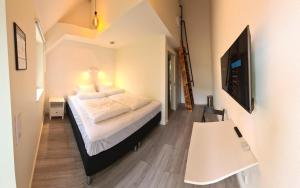 TV a/nebo společenská místnost v ubytování GEG Hotel