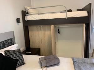 a bedroom with a bunk bed with a bunk beduteneway at petros house in Sarti