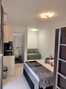 a room with a bed and a couch in it at petros house in Sarti