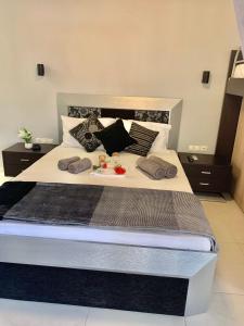 a large bed with pillows on it in a bedroom at petros house in Sarti