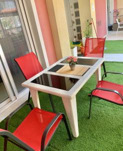 a table and chairs with a plant on top of it at petros house in Sarti