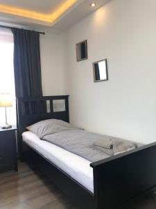 Säng eller sängar i ett rum på Apartment One Bremerhaven