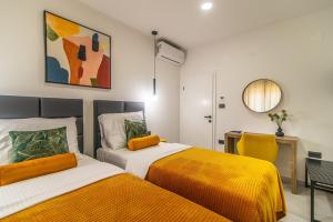 a bedroom with two beds and a desk at Villa Olea in Sveti Petar u Šumi