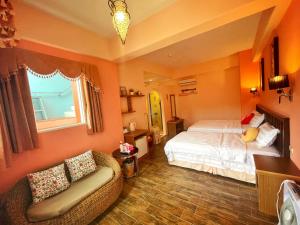 Ένα ή περισσότερα κρεβάτια σε δωμάτιο στο Wonderful Kenting Hostel