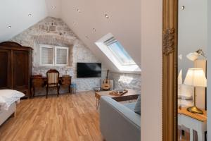 a living room with a couch and a tv at Residence Providenca in Trogir +51 photos