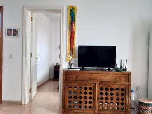 Televízia a/alebo spoločenská miestnosť v ubytovaní Casa Vacanza in Oasis Tamarindo
