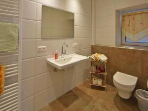 a bathroom with a sink and a toilet at Landhaus Ebner in Millstatt