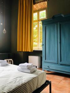 מיטה או מיטות בחדר ב-Casa Conte Rosso