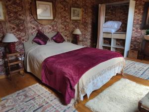 Een bed of bedden in een kamer bij Les quatre vents
