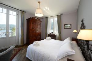 Postel nebo postele na pokoji v ubytování Albergo Ristorante Il Verbano