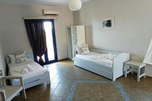 Postel nebo postele na pokoji v ubytování Allegria Family Hotel