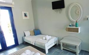 Postel nebo postele na pokoji v ubytování Allegria Family Hotel