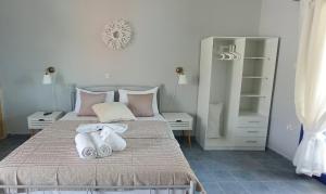 Postel nebo postele na pokoji v ubytování Allegria Family Hotel